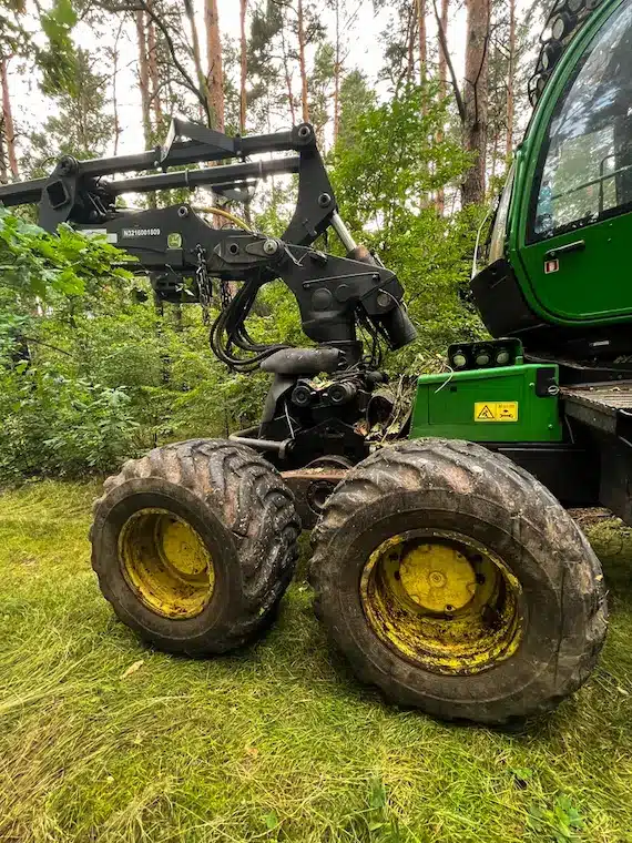 Forestry harvester during a stoppage among trees in the fores.