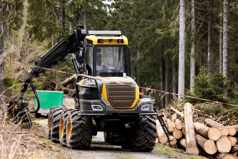 A modern harvester in the forest.