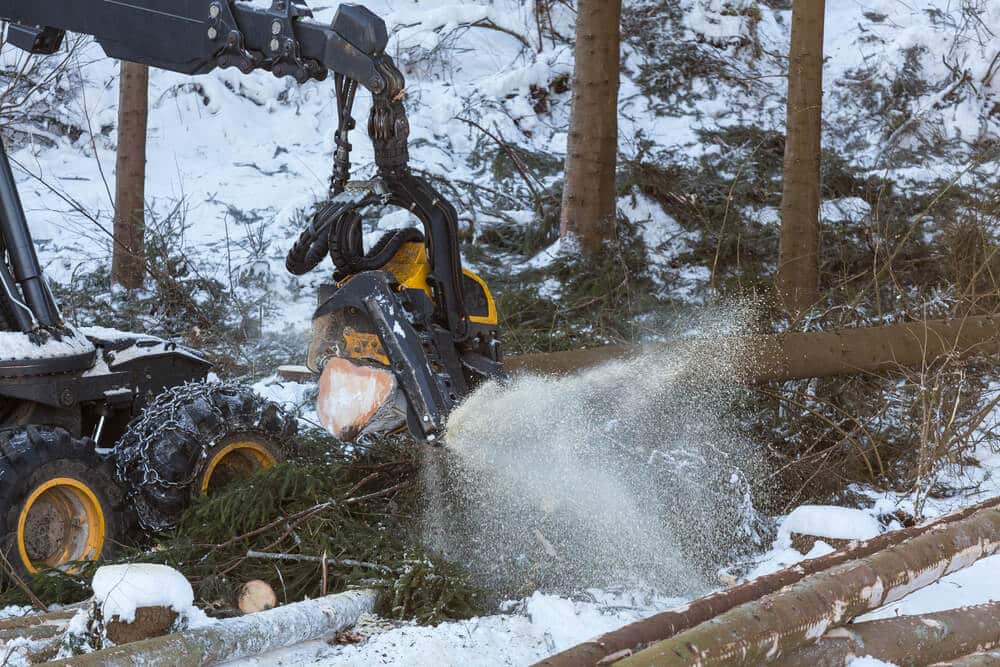 modern forestry machine in a winter forest.